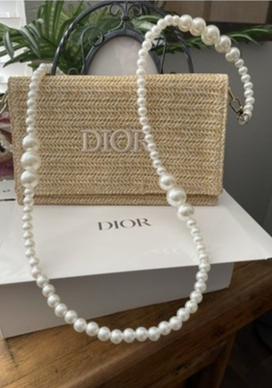 Dior straw clutch purse with long faux pearl strap