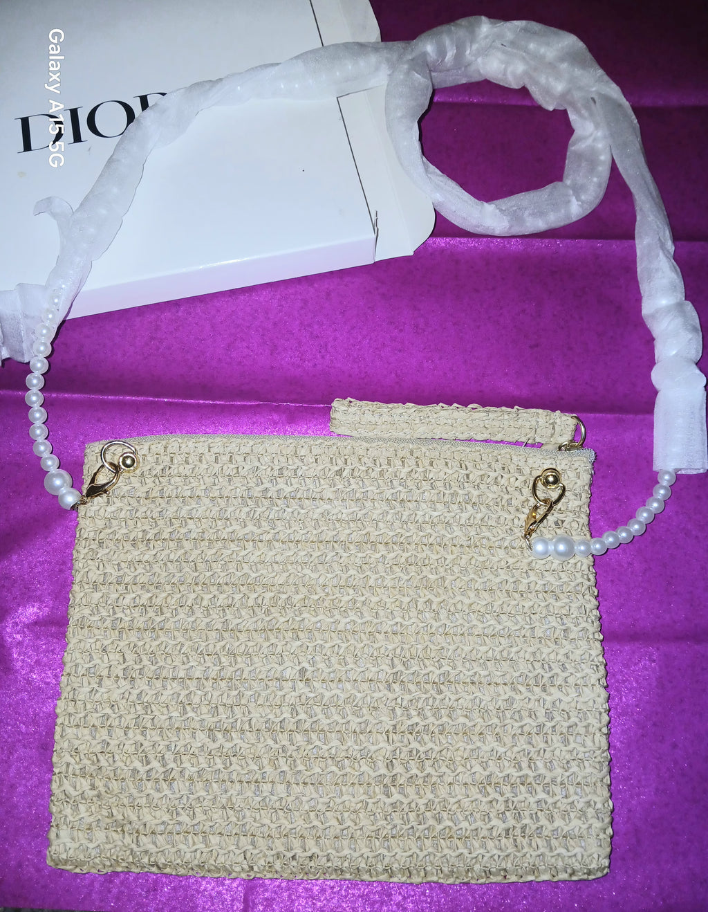 Dior straw clutch purse with long faux pearl strap