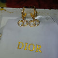 Dior fold tone logo fashion earrings